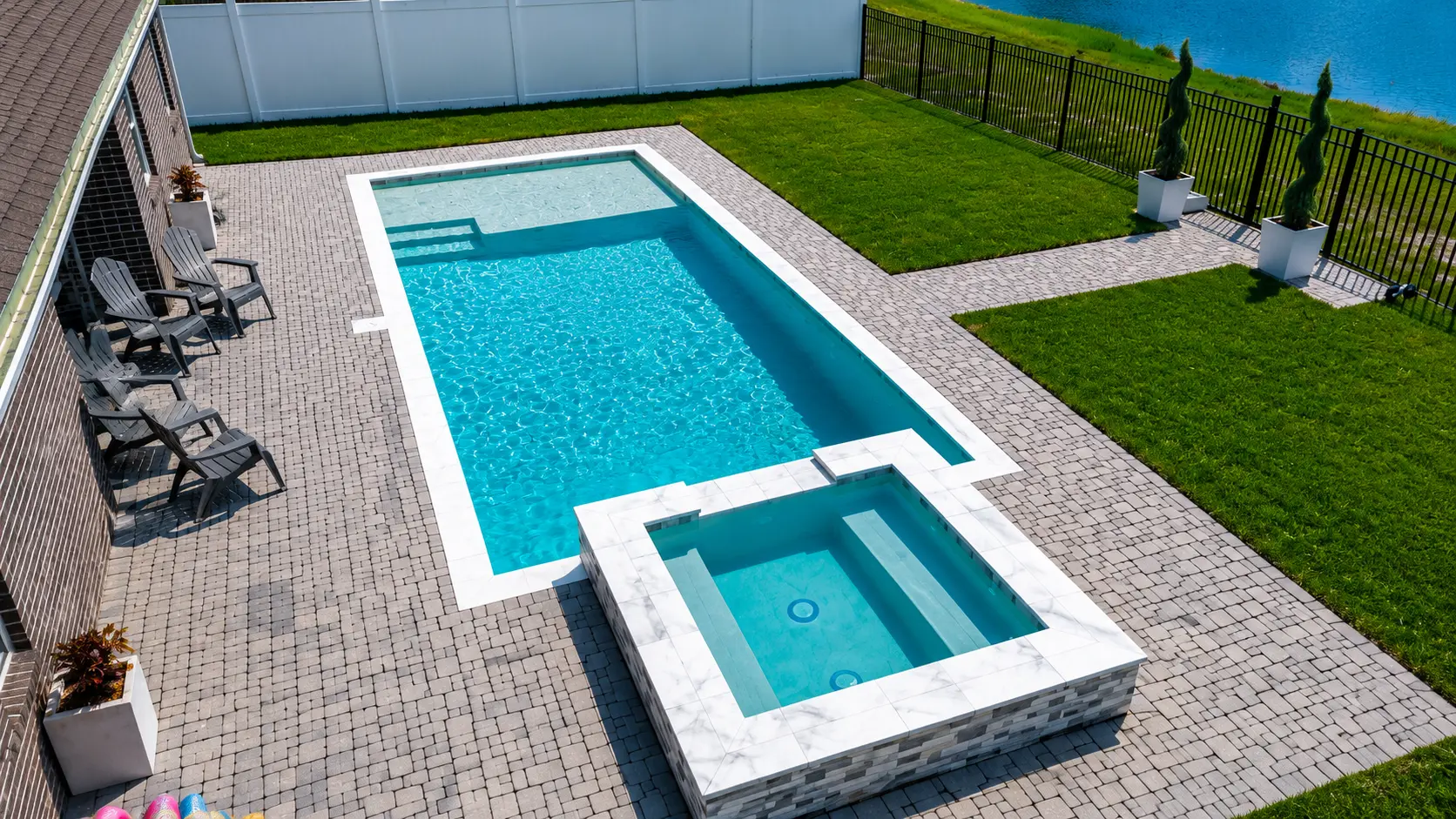 Aerial view of a rectangular custom pool with raised spa by Neway Pools Aerial view of a rectangular custom pool with raised spa by Neway Pools