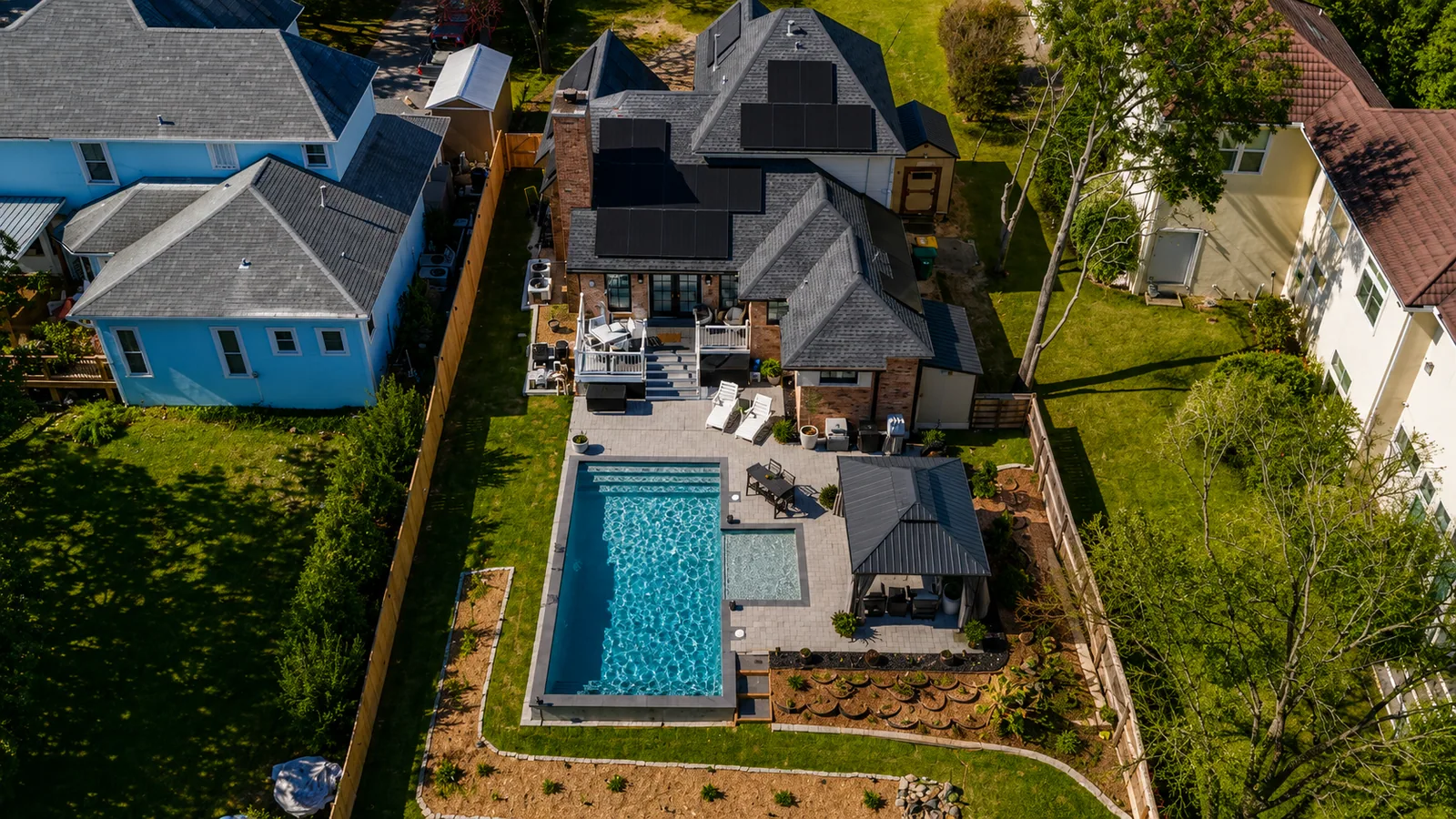 Aerial view of a custom backyard pool built by Neway Pools Aerial view of a custom backyard pool built by Neway Pools