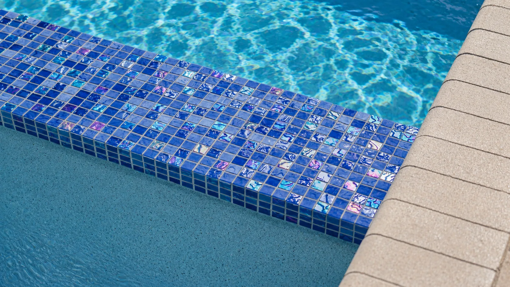 Waterline tile and coping detail on a custom Neway pool