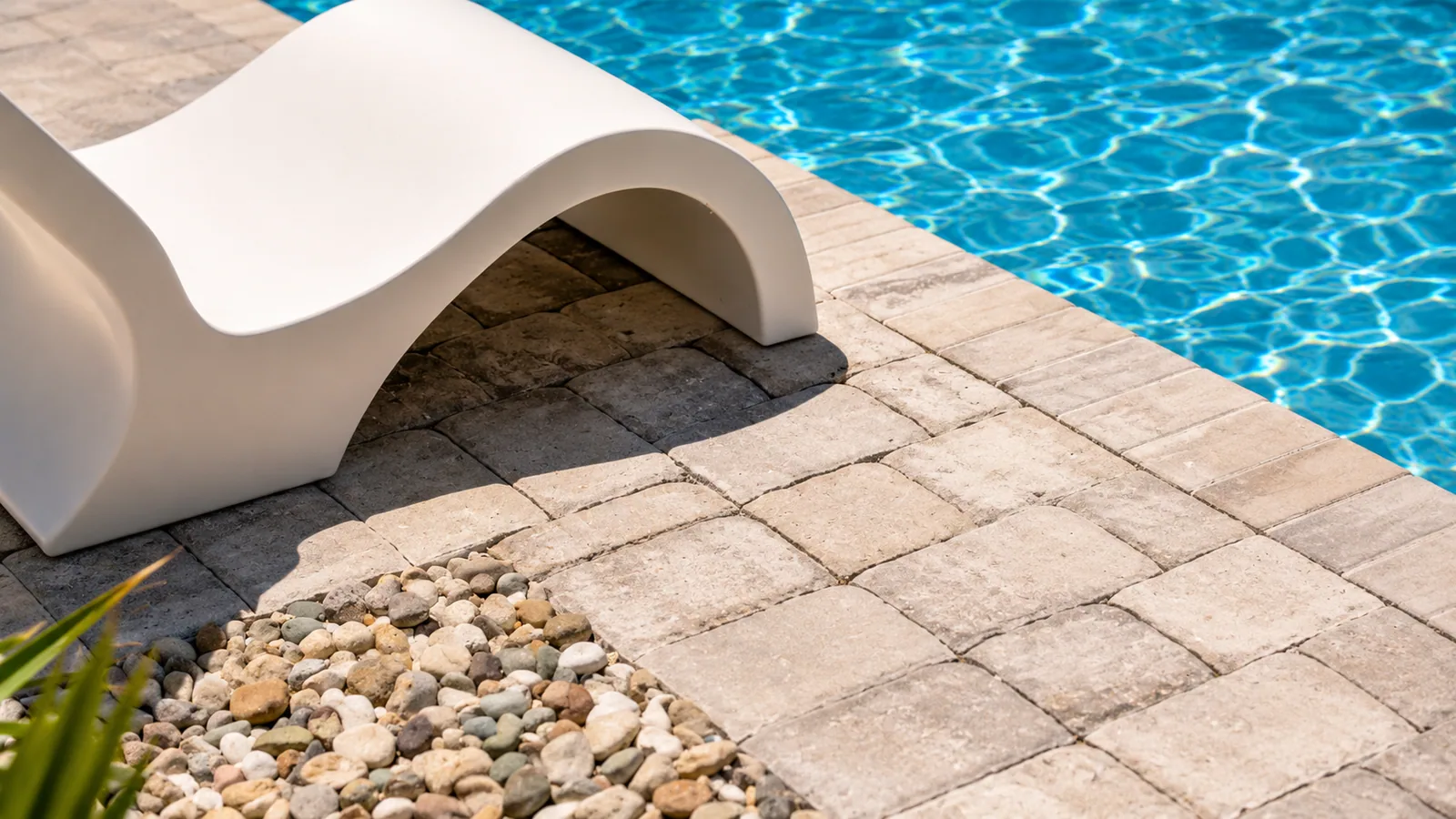 Poolside lounge area beside a custom Neway pool