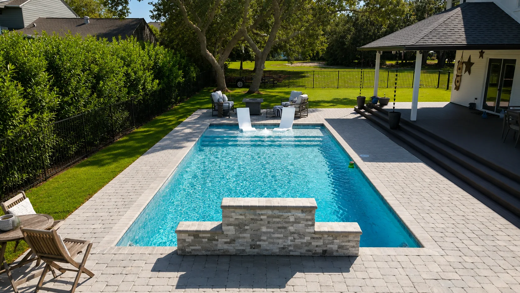 Aerial view of a custom backyard pool built by Neway Pools