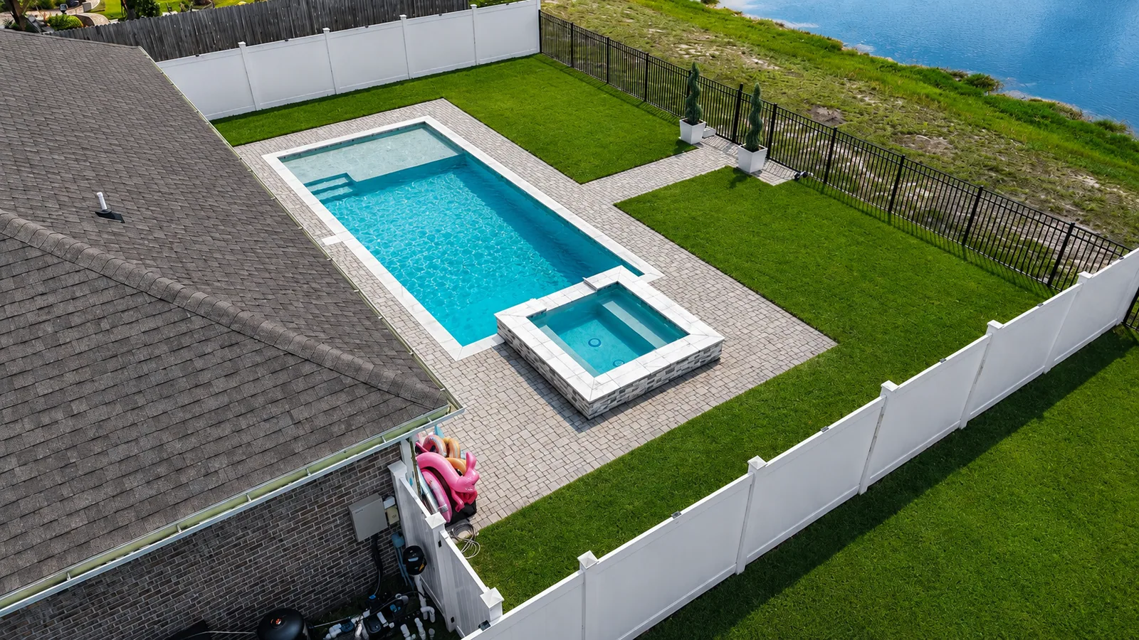Aerial view of a custom backyard pool built by Neway Pools Aerial view of a custom backyard pool built by Neway Pools