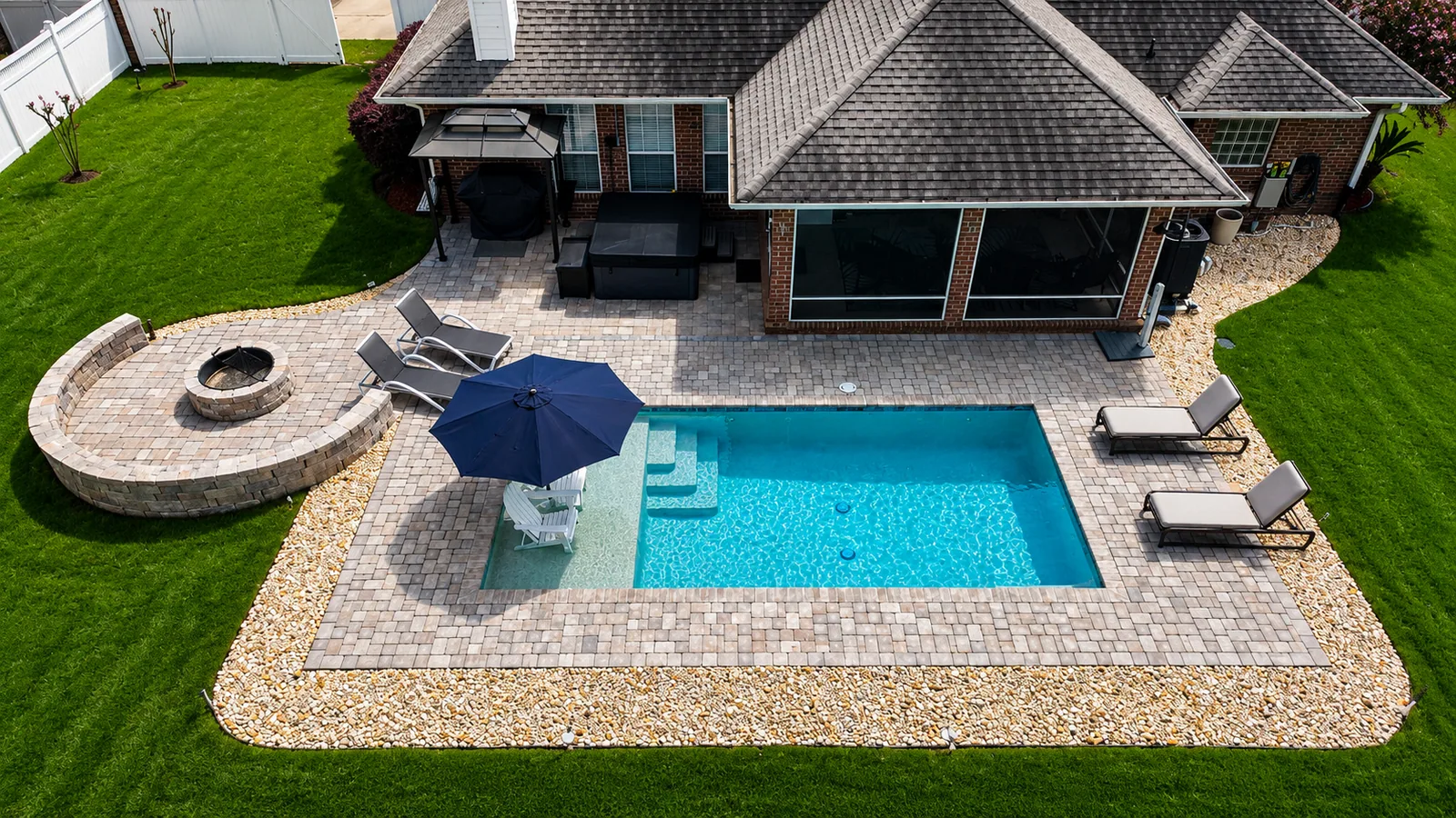Fire feature beside a completed Neway Pools swimming pool