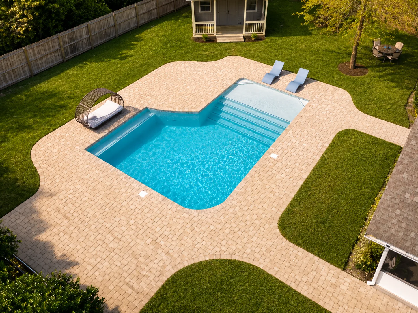 Aerial view of a custom backyard pool built by Neway Pools