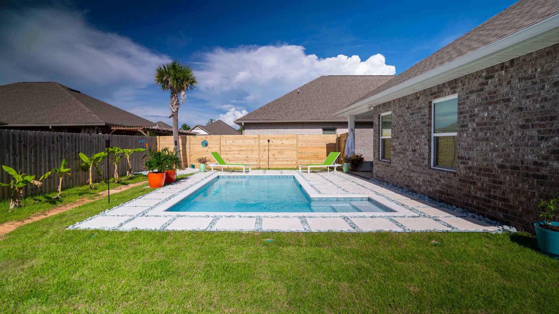 Custom rectangular pool with spa and paver patio by Neway Pools Custom rectangular pool with spa and paver patio by Neway Pools