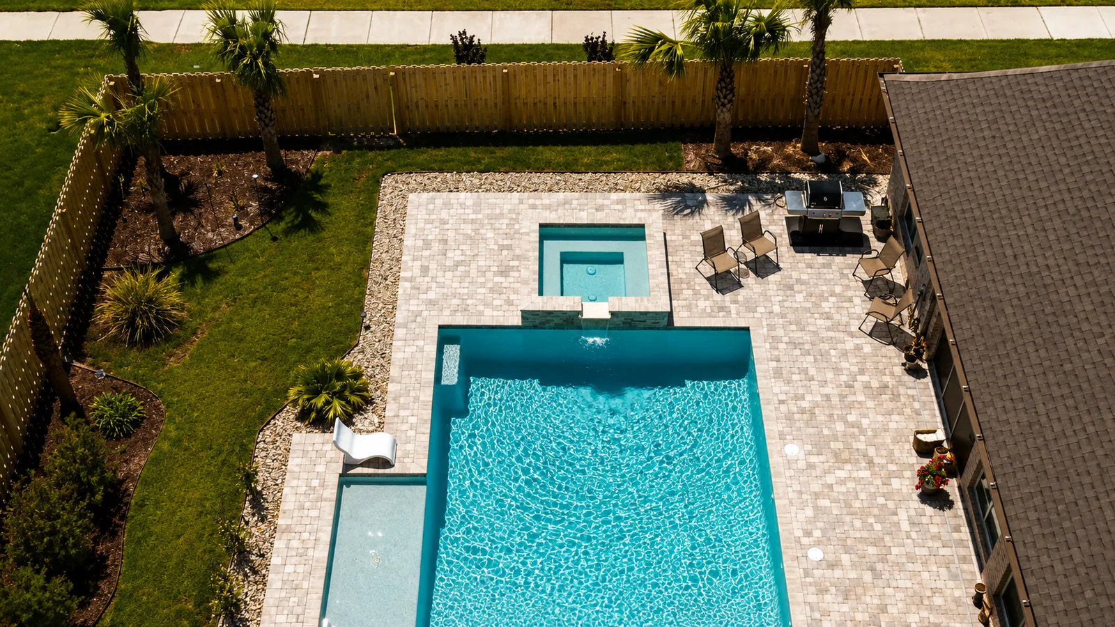 Aerial view of a custom backyard pool built by Neway Pools