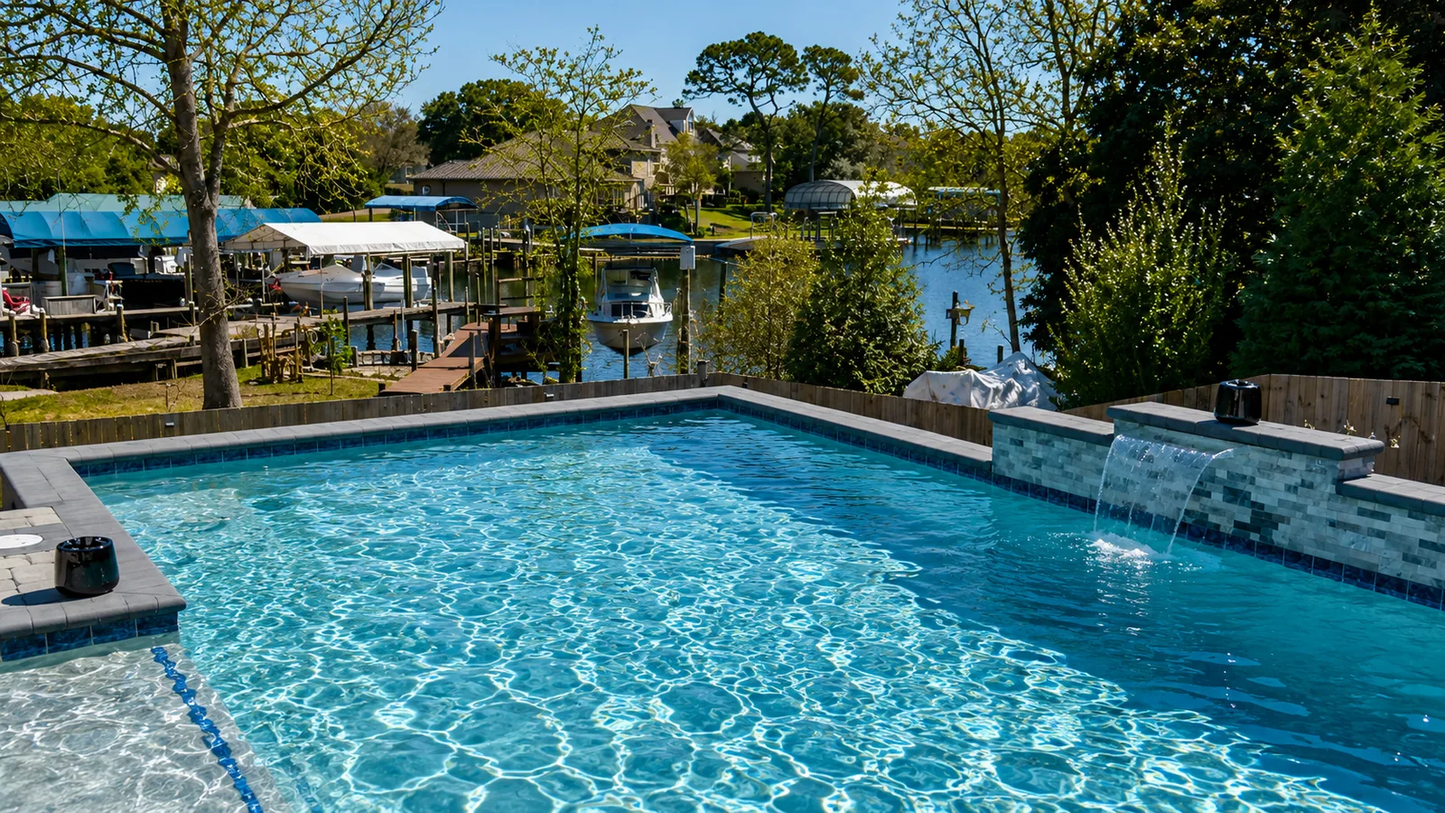 Custom rectangular swimming pool with paver decking Custom rectangular swimming pool with paver decking